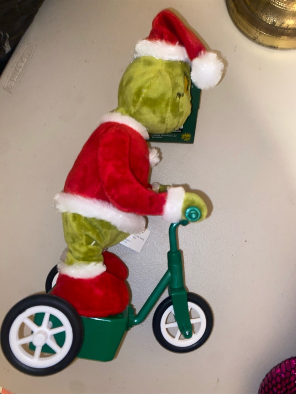Holiday Plush Character on Green Tricycle - Festive Red & Green Decor